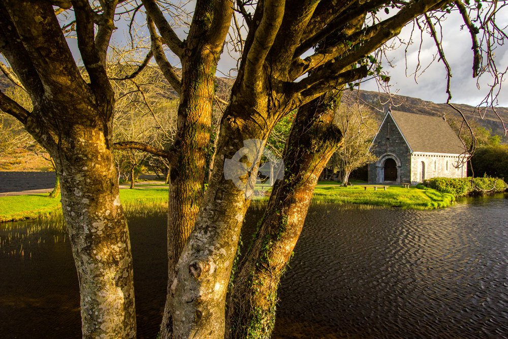 Photo of the church on the gougane barra island in early morning light