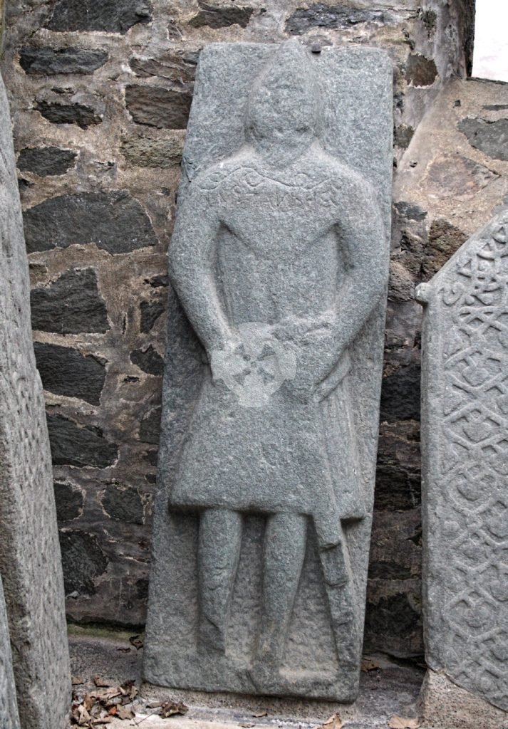 Photo of a carved grave slab of a warrior figure, Kilmartin, Scotland